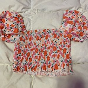 Floral tube top with sleeves. Never worn. (COULD FIT GIRLS TOO)